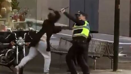 Hassan Khalif Shire Ali attacks a policeman during last week’s Bourke Street terror attack. Picture: Twitter