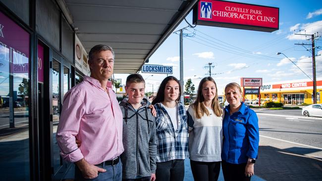 Dr Chris Hume-Phillips with children Mitchell, 13, Monique, 16, Tayla, 16, and wife Trudy in front of their family business Clovelly Park Chiropractic Clinic. Picture: Tom Huntley