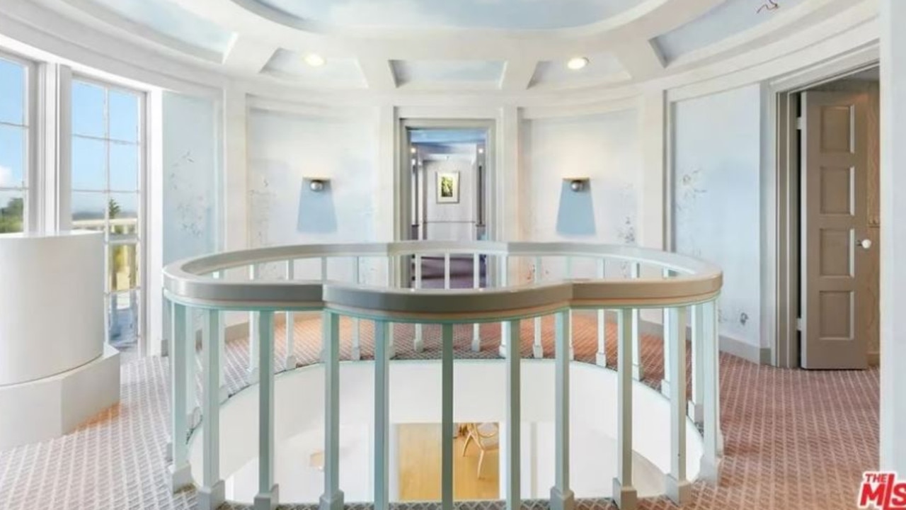 Simmons appears to have had a fondness for unique artwork, with several spaces in the home boasting blue sky-themed paintwork. Picture: Realtor