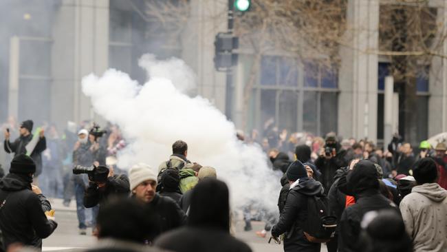 Police deploy smoke and pepper grenades during clashes with protesters. Picture: AP