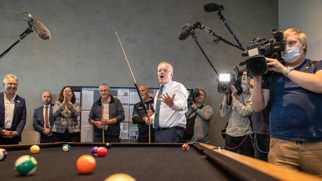 The PM did not go easy on retirement villagers once he picked up a pool cue. Picture: Jason Edwards