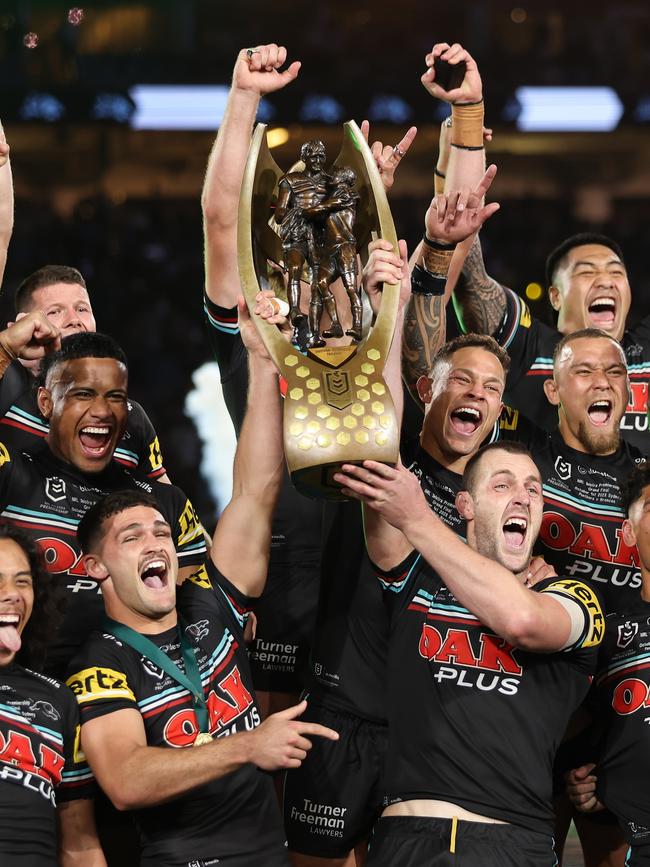 Isaah Yeo (bottom right) lifts the premiership trophy. Picture: Matt King/Getty Images