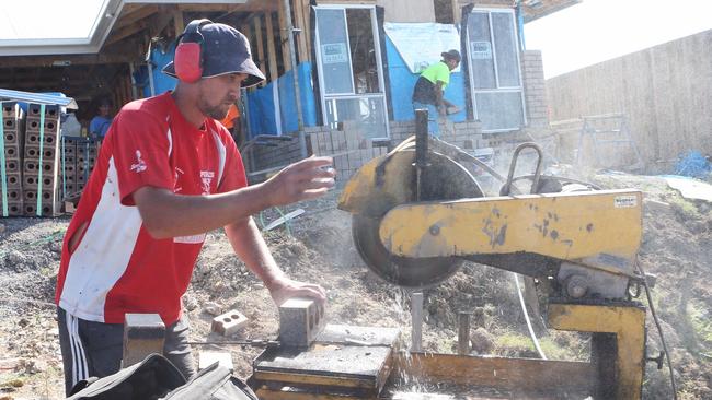 Bricklayer Kalleum Paraone works at a house in Pimpama. Picture: Jono Searle.