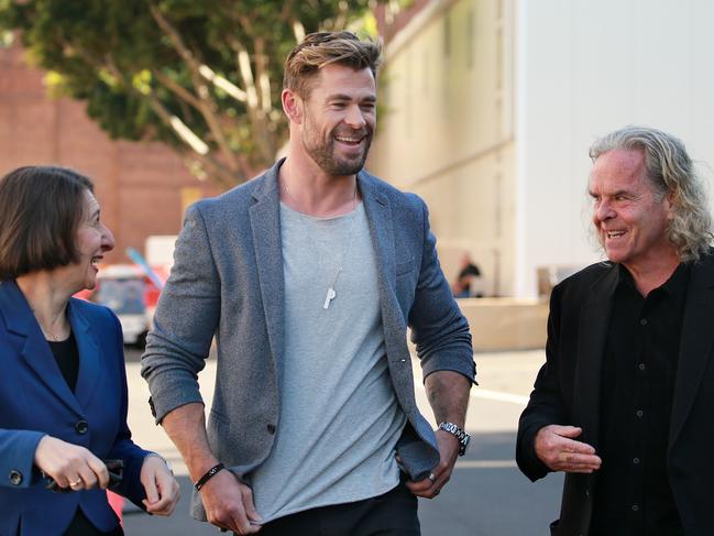 SYDNEY, AUSTRALIA - NewsWire Photos APRIL, 19, 2021: Pictured is Gladys Berejiklian arriving with actor Chris Hemsworth and producer Doug Mitchell at Fox Studios Australia in Sydney for a major blockbuster announcement of Mad Max sequel Furiosa, that will be filmed in NSW. Picture: NCA NewsWire / Dylan Coker