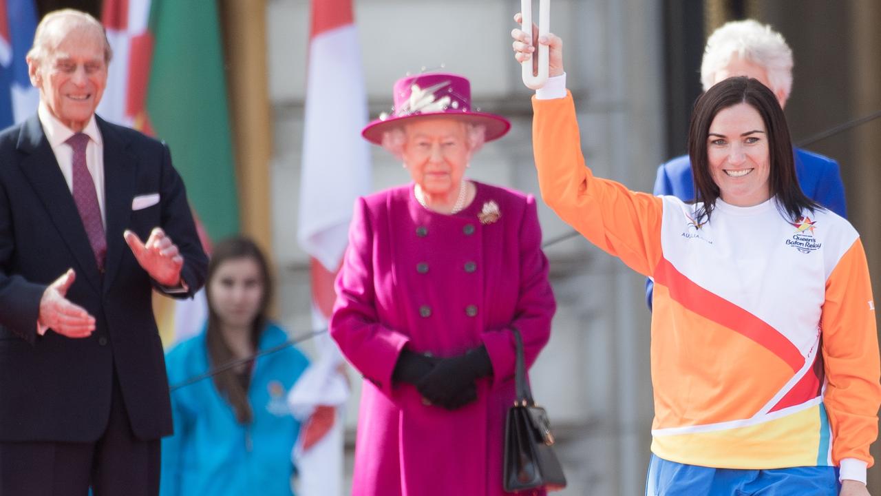 Anna Meares carries the Commonwealth baton as Queen Elizabeth II and Prince Philip, Duke of Edinburgh look on during the launch of The Queen's Baton Relay for the XXI Commonwealth Games being held on the Gold Coast in 2018 at Buckingham Palace on March 13, 2017 in London, England. Picture: Samir Hussein/Samir Hussein/WireImage