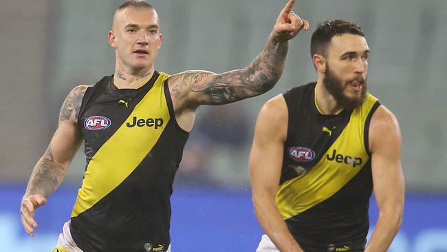 Richmond’s Dustin Martin directs traffic behind Shane Edwards. Pic: Michael Klein