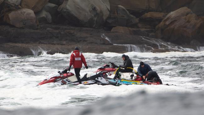 Surfer Mike Brennan from Sandy Bay being rescued at Shipstern Bluff. Picture: Andy Chisholm.