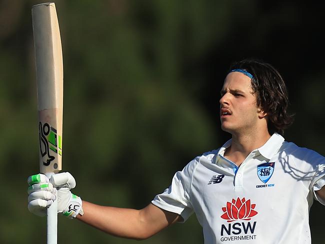 SYDNEY, AUSTRALIA - OCTOBER 10: Sam Konstas of the Blues raises his bat in the air after hitting a six to reach his century during the Sheffield Shield match between New South Wales and South Australia at Cricket Central, on October 10, 2024, in Sydney, Australia. (Photo by Mark Evans/Getty Images)