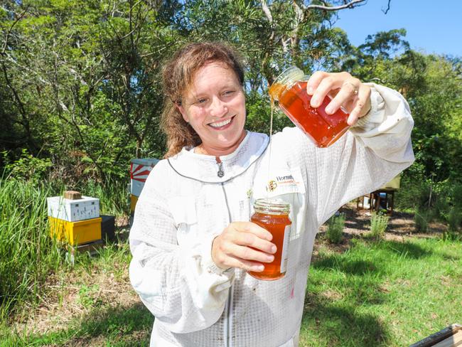 UNDER STRICT EMBARGO FOR AT HOME. DO NOT USE! PLEASE CHECK WITH EDITOR DIANA JENKINS PRIOR TO USE, THANKS. Bee Keeper Michelle Blyme at Oxford Falls with her hobby bee hive Picture by Renee Nowytarger / At Home 15/03/23