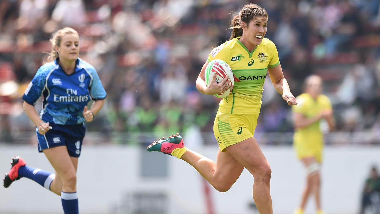 Charlotte Caslick of Australia makes a break at Mikuni World Stadium in Fukuoka.