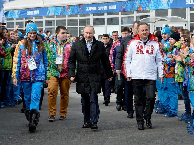 Russian President Vladimir Putin, centre, visits the Olympic Athletes Village in Coastal Cluster ahead of the Sochi 2014 Winter Olympics with Olympic Village Mayor Elena Isinbaeva, left, and Russian Minister of Sport, Tourism and Youth policy Vitaly Mutko on February 5, 2014.