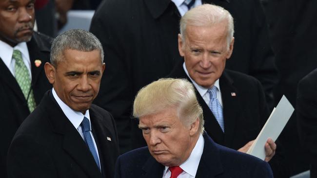 Outgoing president Barack Obama and Joe Biden at the inauguration ceremony of Donald Trump in 2017. Picture: AFP