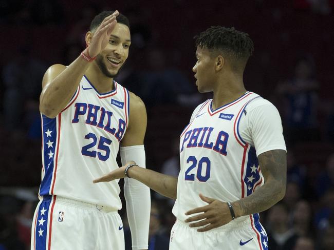 A rare joyful moment for Markelle Fultz (right) on the basketball court.