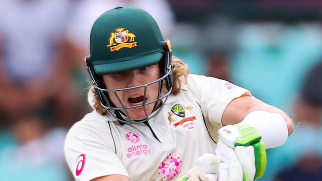 TOPSHOT - Australia's Will Pucovski plays a shot during the first day of the third cricket Test match between Australia and India at the Sydney Cricket Ground (SCG)in Sydney on January 7, 2021. (Photo by DAVID GRAY / AFP) / -- IMAGE RESTRICTED TO EDITORIAL USE - STRICTLY NO COMMERCIAL USE --