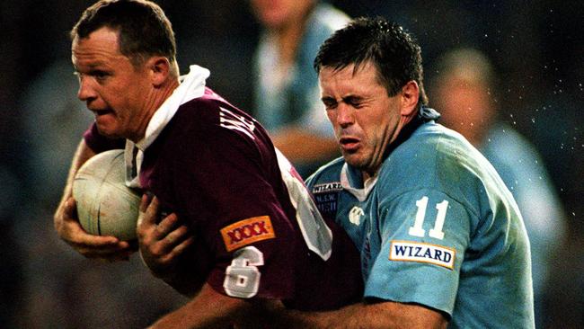 Kevin Walters (ball) tackled by Dean Pay during game 1 of NSW v Queensland State of Origin Series at SFS, 22/05/98. Rugby League A/CT