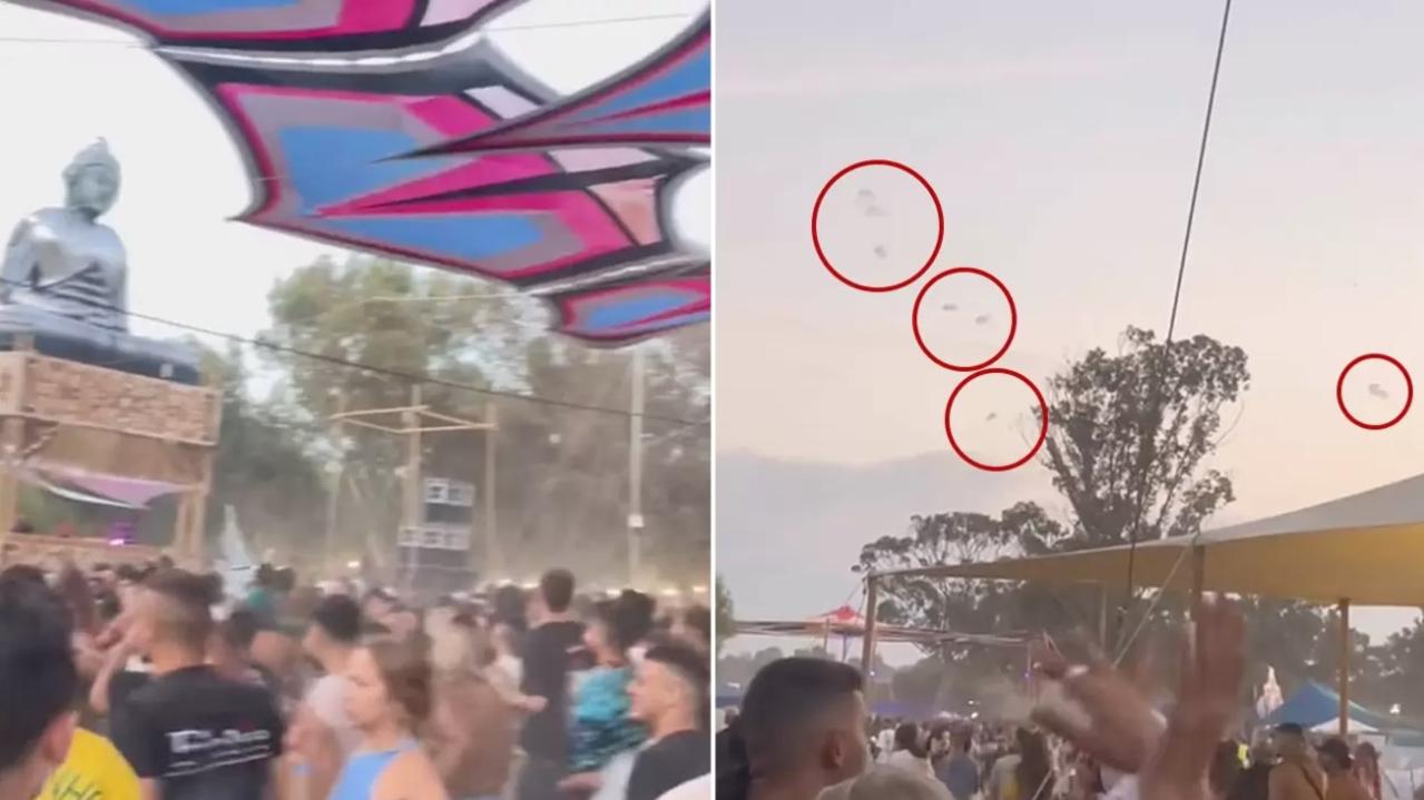 The moment Hamas militants parachute into the music festival.