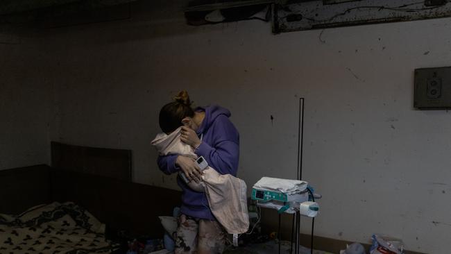 A mother tends to her baby that is under medical treatment in the bomb shelter of the paediatric ward in Kyiv, Ukraine. Picture: Getty Images