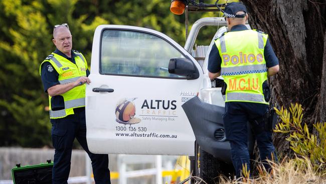 MCIU and forensics officers inspect the workers’ ute. Picture: Mark Stewart