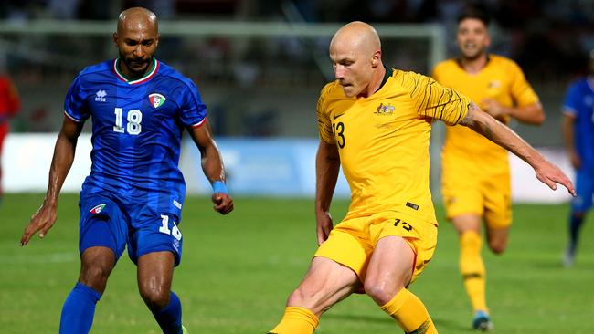 Socceroos midfielder Aaron Mooy in action against Kuwait. The temperature was 38C at kick-off. Picture: Getty Images