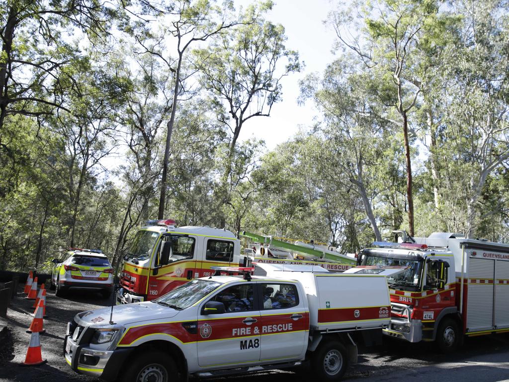 Emergency Service Crews at the bottom of Mount Ngungun where a woman has died after falling about 50 metres. Photo Lachie Millard