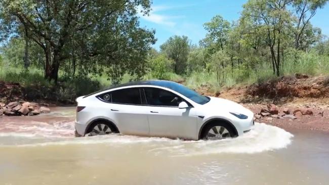 The Tesla Y taking on a flood affected bit of road on Mr Murphy's trip. Picture: Supplied