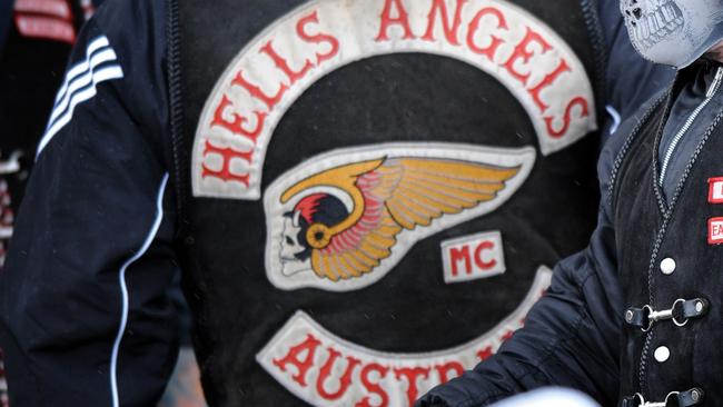 A Hells Angels enforcer has been refused bail after he allegedly kidnapped a woman over a perceived debt.