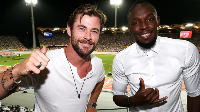 Usain Bolt and Chris Hemsworth on at the athletics this week. (Photo by Hagen Hopkins/Getty)