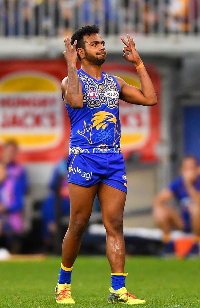 Rioli celebrates a goal last weekend with a tribute to cousin Cyril who announced his retirement from Hawthorn. Picture: Daniel Carson (Getty).