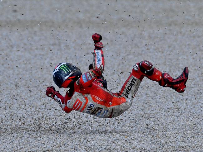 Jorge Lorenzo crashes out on turn 8.