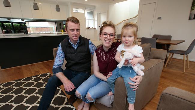 Liam and Emily Keegan at home in Mordialloc with their daughter Imogen, 20 months. They recently refinanced their home loan for a better rate saving them thousands of dollars a year. Picture: Ian Currie.