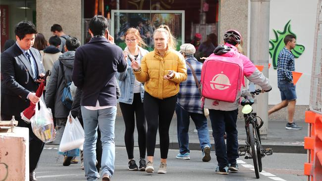 Pedestrians cross at the intersection of George St and Ultimo Rd in Haymarket at the site of the incident. Picture: David Swift