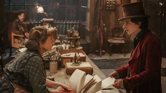 Olivia Colman and Timothee Chalamet in a scene from the movie Wonka.