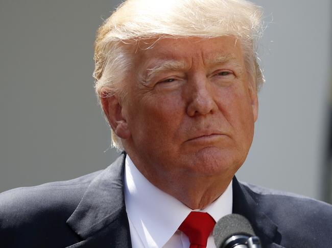 In this photo taken July 26, 2017, President Donald Trump pauses while speaking in the Rose Garden of the White House in Washington.  (AP Photo/Alex Brandon)