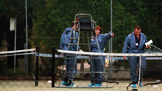 Police scientific officers examine the scene after the shooting of Constable Chris Patrech. File picture