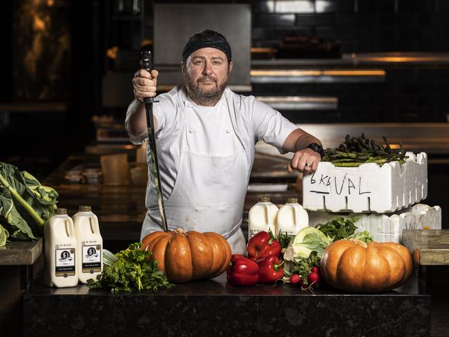 Scott Pickett poses for a photograph with perishable produce in his closed restaurant Estelle in Northcote, Victoria. Photo: Daniel Pockett / The Australian