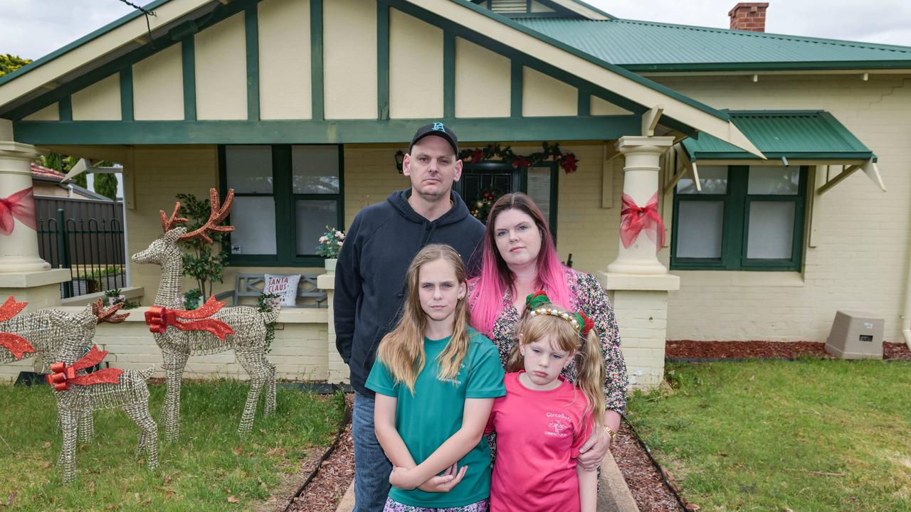 York Ave residents Scott and Laura Miles with their daughters Vegas and Buffy outside their Clovely Park home that will be demolished because of the South Rd upgrade. Picture: NCA NewsWire / Brenton Edwards