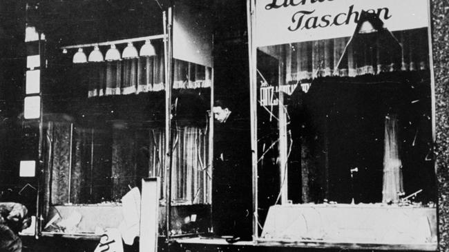 A man surveys the damage to the Lichtenstein leather goods store after the Kristallnacht pogrom in Berlin, November 1938.