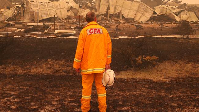 CFA fire chief Steve Warrington at a destroyed house in Buchan. Picture: David Crosling