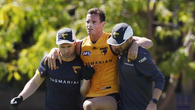 MELBOURNE , AUSTRALIA.February 15 , 2024.  AFL. Hawthorn Intraclub practise match at Waverley  Park.   James Blanck of the Hawks  is helped club staff after appearing to hurt his left knee during the clubs intra club hit out  . Pic: Michael Klein