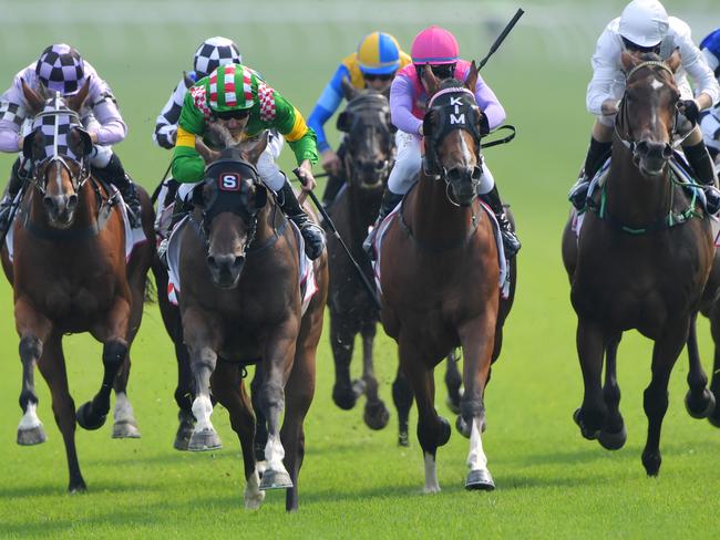 Christian Reith rides Jen Rules to victory in the Ranvet Handicap.