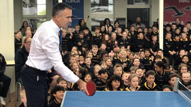 Premier Peter Malinauskas playing table tennis in front of Henley Beach Primary School students on Monday. Picture: Shashi Baltutis