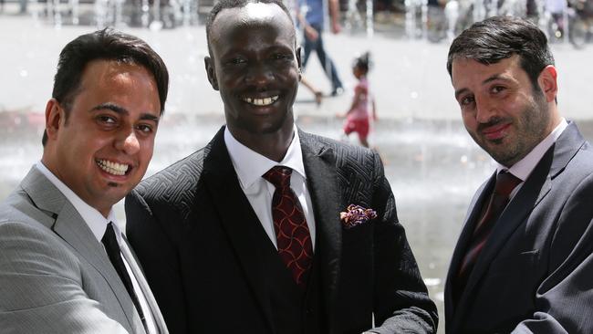 Deng Adut, with business partners Joseph Correy and Michael Moussa, have opened a second branch of their law firm in Sydney’s Parramatta. Picture: Ian Svegovic