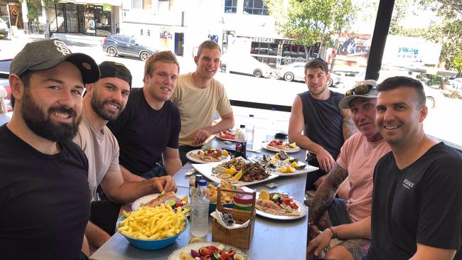 Aaron Woods, James Tedesco, Jake Trbojevic, Tom Trbojevic, Curtis Scott, Ian ‘Rebel’ Mathie and Damien Notaras enjoying lunch.