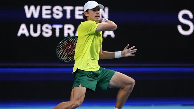 PERTH, AUSTRALIA - JANUARY 03: Alex de Minaur of Team Australia plays a forehand in his singles match against Novak Djokovic of Team Serbia during day six of the 2024 United Cup at RAC Arena on January 03, 2024 in Perth, Australia. (Photo by Paul Kane/Getty Images)