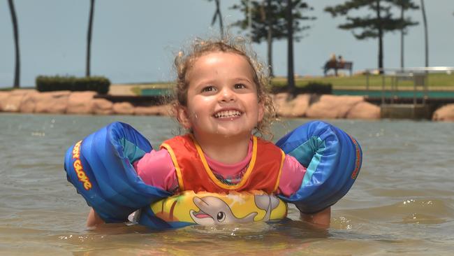 Lily Mansey, 2, from the Sunshine Coast practices her turtle swimming at the rock pool on the Strand. Picture: Evan Morgan