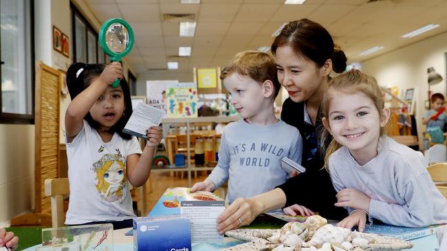 Educator Isobel Toh with, from left, Samneet, Xander and Ella at Goodstart Early Learning Centre in North Sydney. Picture: Nikki Short