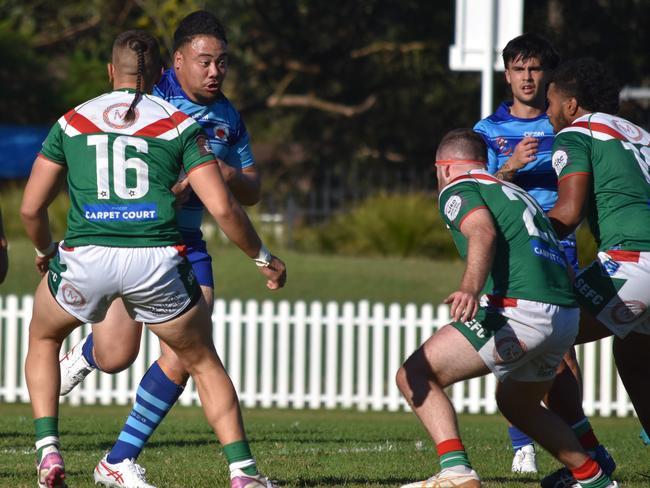 Shane Tomokino runs at Nathaniel Gallo (left) and D'Arcy Hardman. Picture: Sean Teuma/NewsLocal