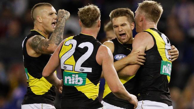 Richmond players celebrate a goal against the Kangaroos. Picture: Getty Images