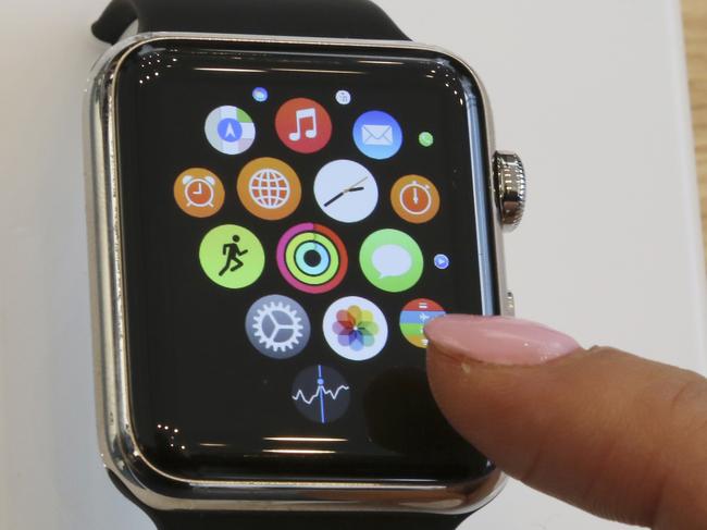 FILE - In this April 10, 2015 file photo, a customer demonstrates Apple Watch at an Apple Store in Tokyo. A new report on Thursday, Aug. 17, 2015, estimates Apple shipped 3.6 million watches in the last quarter , more than some analysts have estimated and enough to change the competitive landscape for fitness bands and other wearable gadgets.(AP Photo/Koji Sasahara)
