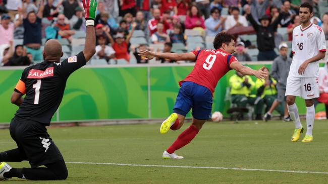 South Korea's Cho Young Cheo celebrates after scoring a goal.